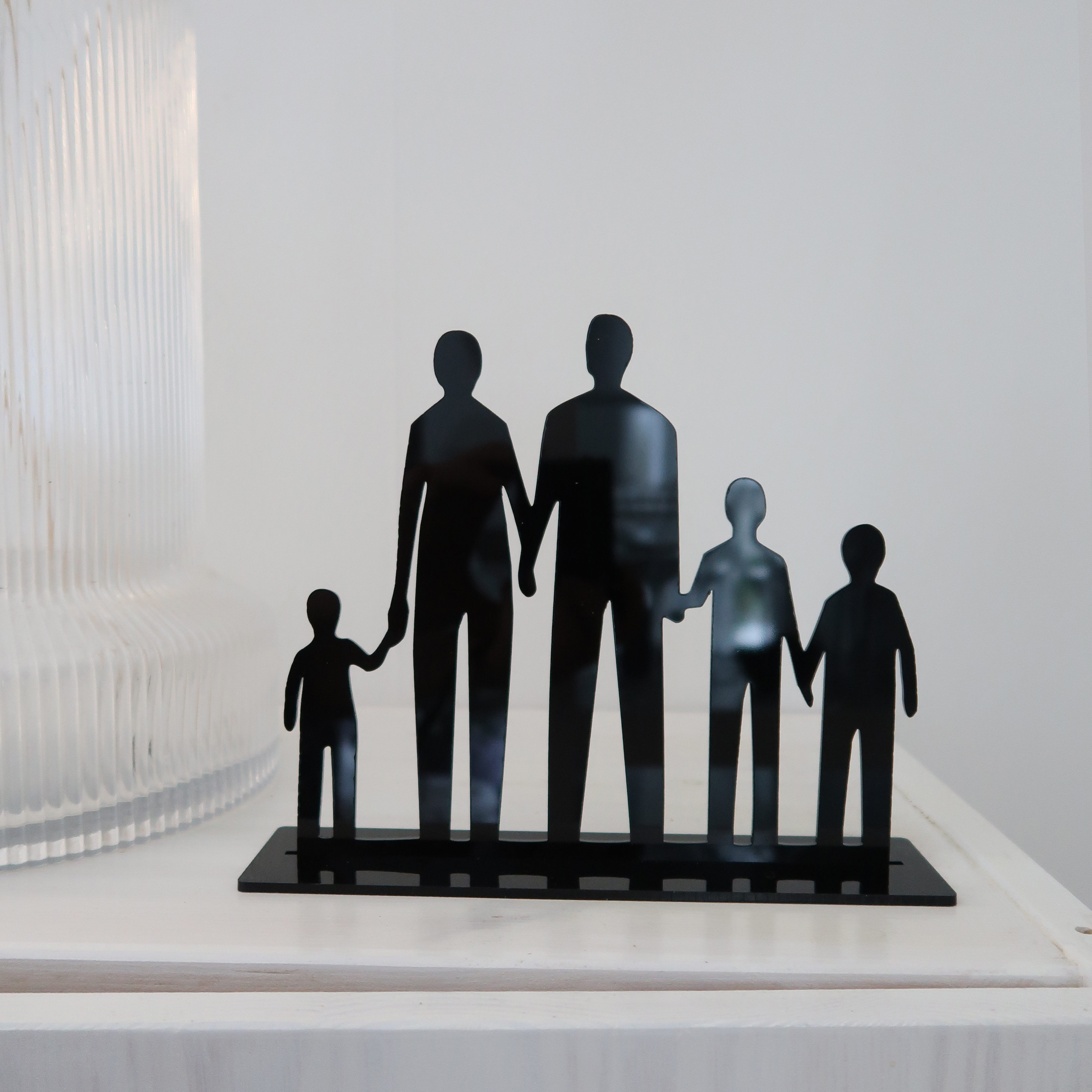 Siluett - Familj med fem familjemedlemmar