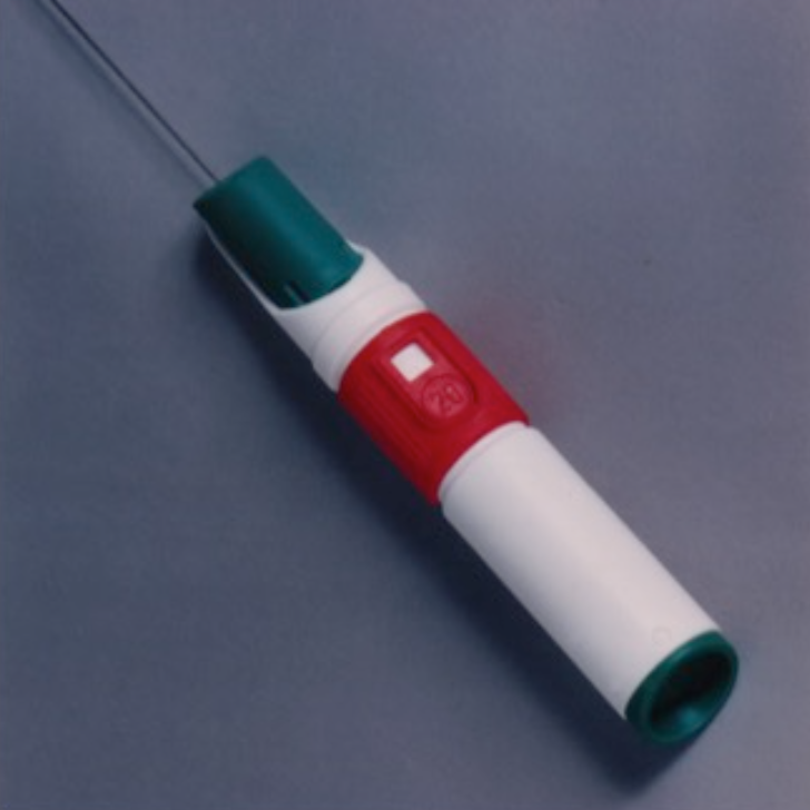 A white, green and red biopsy gun.