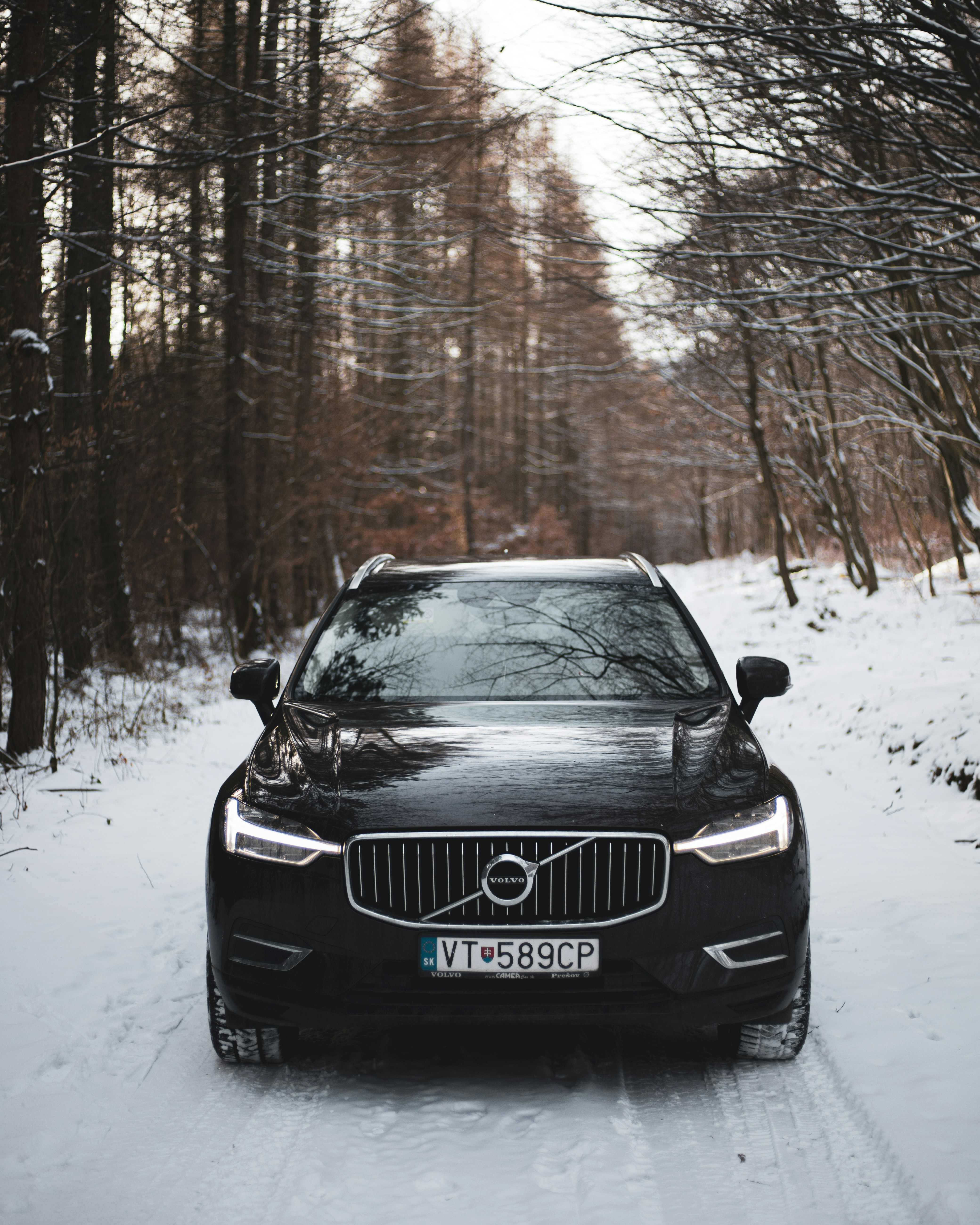 black volvo car in snow weather